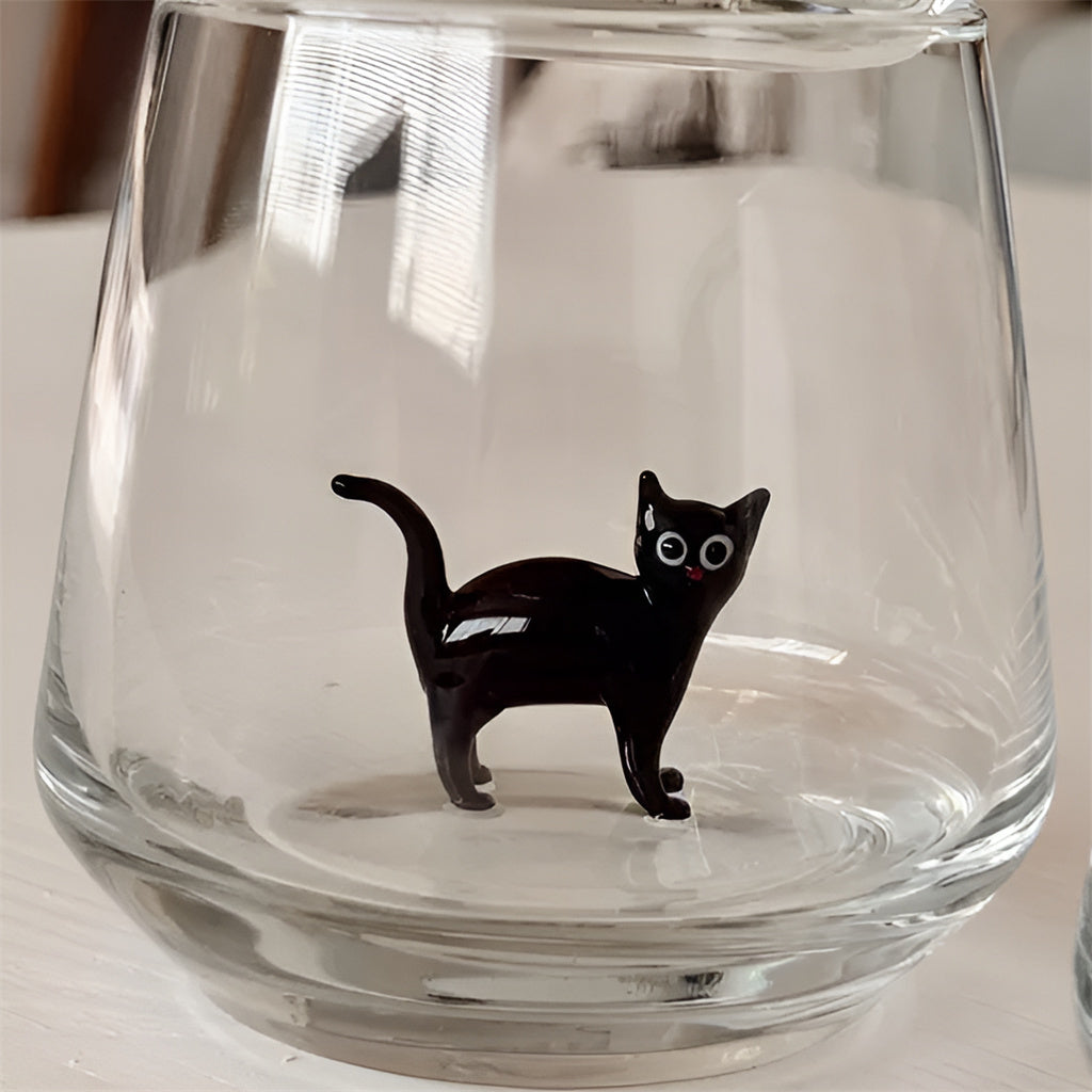 Drinking Glass with Cat Figurine